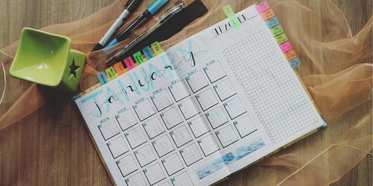 calendar in a notebook with colorful tabs