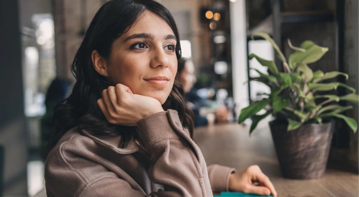woman in a leather jacket with dark hair